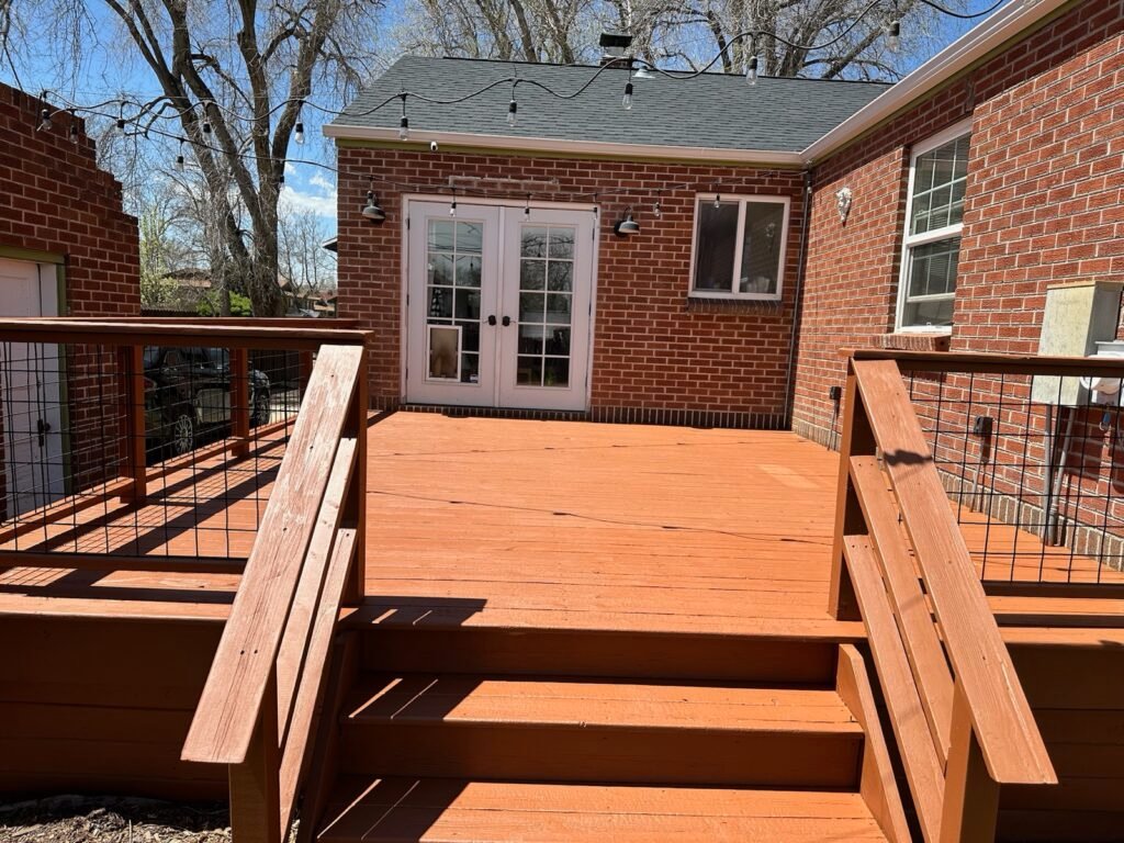 Stained deck brick house